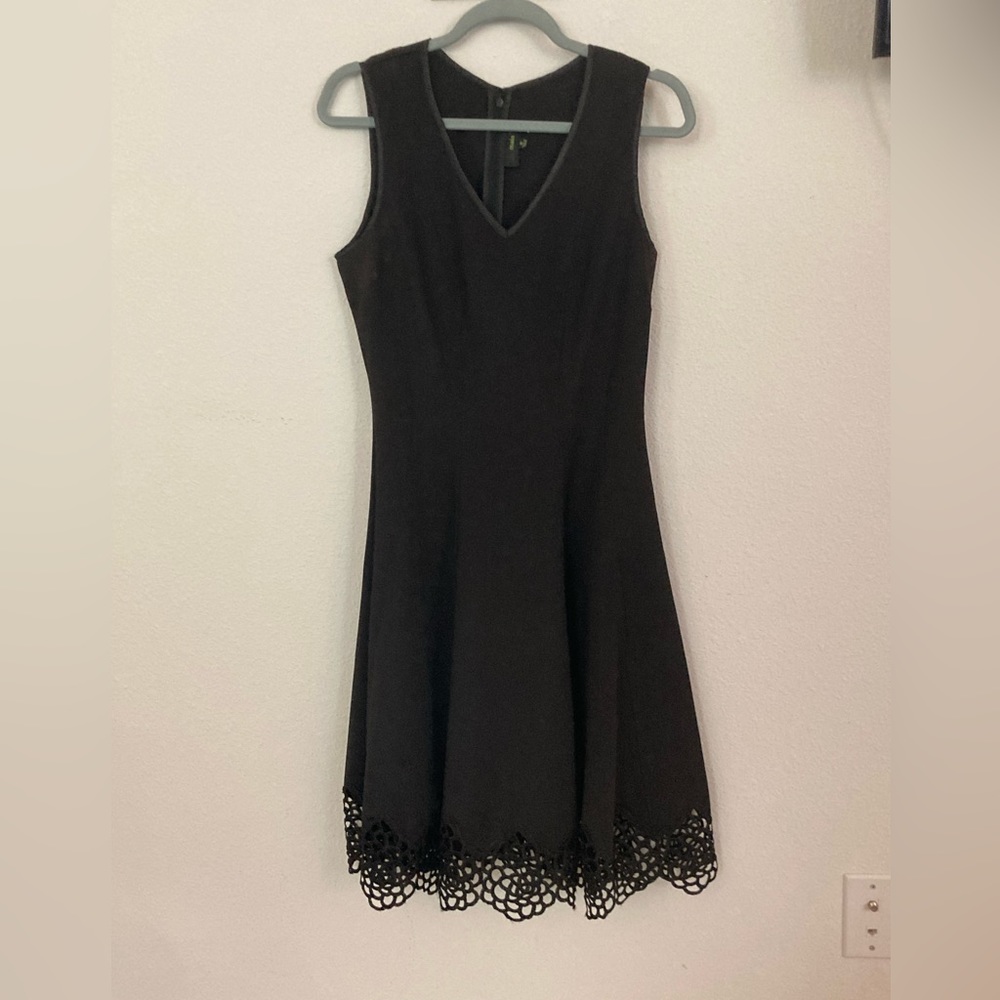 Super flattering little black dress with flower cut out detailed hem